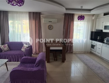 Small apartment 1+1, with a total area of 65 m2, 450 meters from the sea in the center of Mahmutlar.-id-4440-photo-2