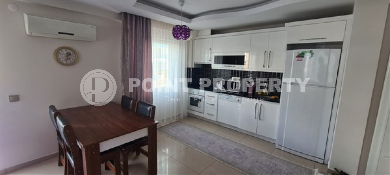 Небольшая квартира 1+1, общей площадью 65 м2, в 450 метрах от моря в центре района Махмутлар.-id-4440-фото-3