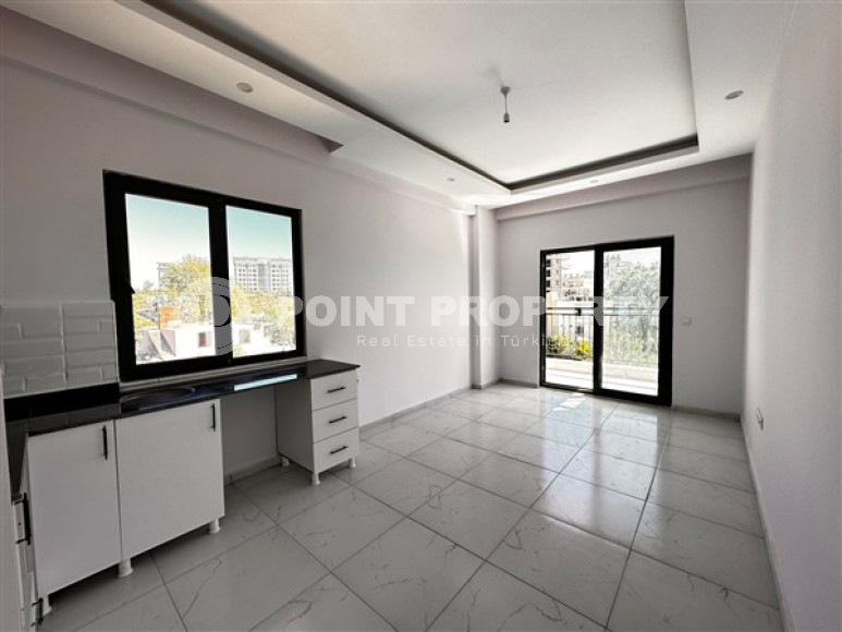 Небольшая квартира с чистовой отделкой в новом жилом комплексе в спокойном благоустроенном районе Авсаллар.-id-4453-фото-2