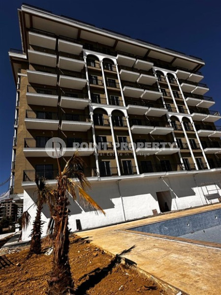 Небольшая квартира с чистовой отделкой в новом жилом комплексе в спокойном благоустроенном районе Авсаллар.-id-4453-фото-17