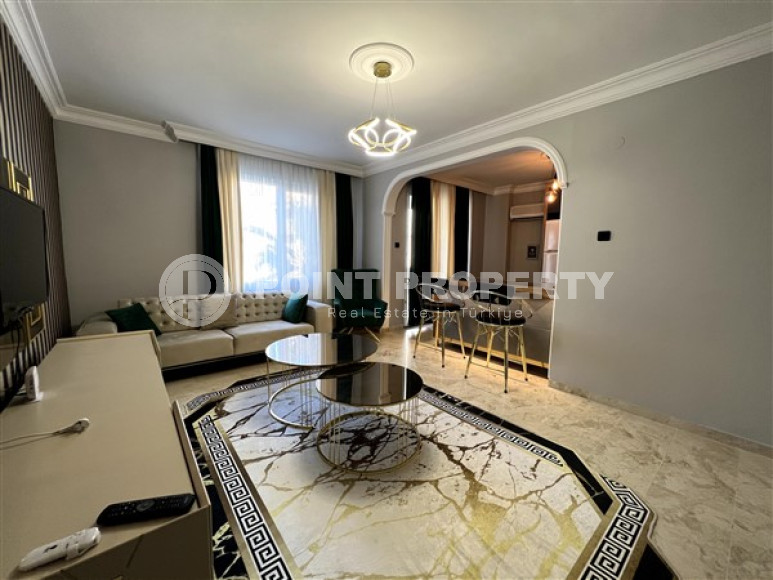 Stylish apartments with designer renovation on the very seashore in the center of Mahmutlar.-id-4455-photo-2