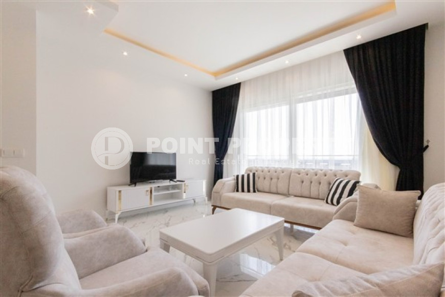 Прекрасная светлая квартира 1+1 на 8-м этаже с панорамным видом на город и горы в 500 метрах от моря.-id-4459-фото-1