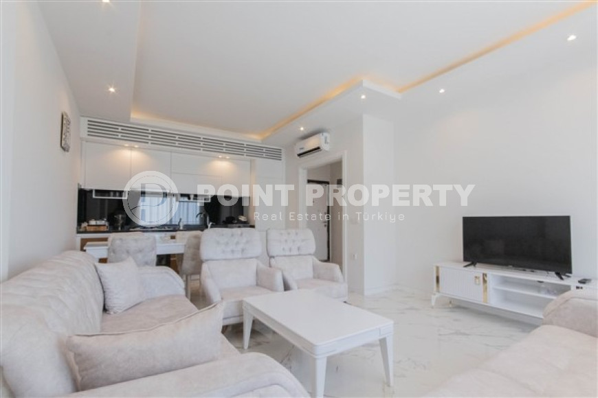 Прекрасная светлая квартира 1+1 на 8-м этаже с панорамным видом на город и горы в 500 метрах от моря.-id-4459-фото-3