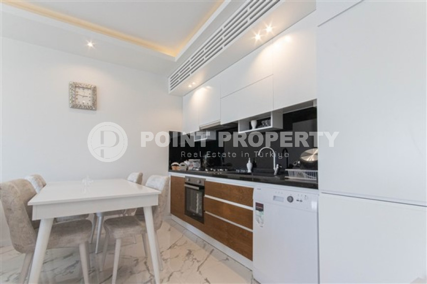 Прекрасная светлая квартира 1+1 на 8-м этаже с панорамным видом на город и горы в 500 метрах от моря.-id-4459-фото-4