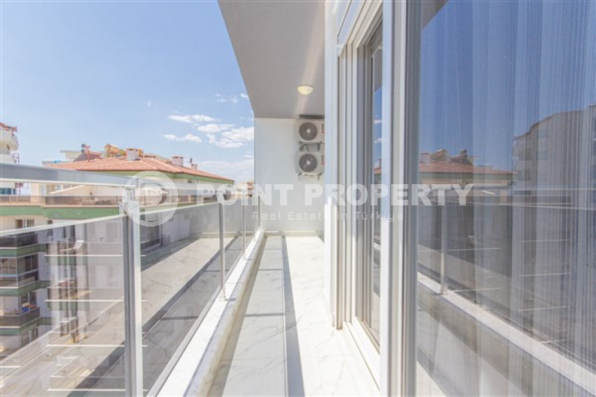 Прекрасная светлая квартира 1+1 на 8-м этаже с панорамным видом на город и горы в 500 метрах от моря.-id-4459-фото-8