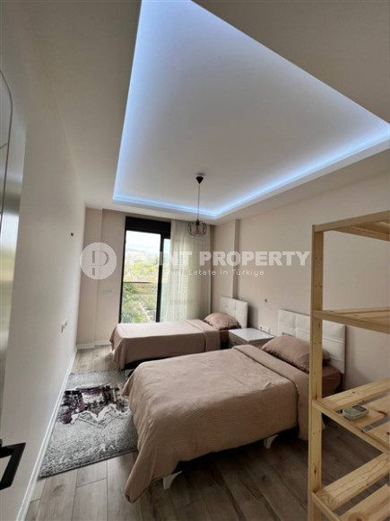 Стильная современная квартира 2+1 в 600 метрах от моря в центре спокойного района Аланьи Тосмур.-id-4465-фото-5