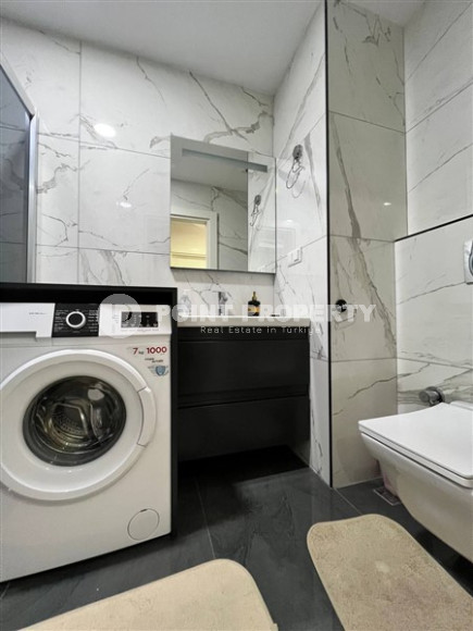 Стильная современная квартира 2+1 в 600 метрах от моря в центре спокойного района Аланьи Тосмур.-id-4465-фото-8