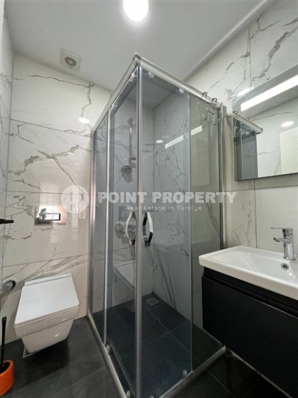 Стильная современная квартира 2+1 в 600 метрах от моря в центре спокойного района Аланьи Тосмур.-id-4465-фото-9