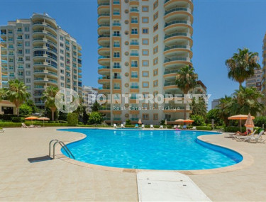 Inexpensive apartment 60 m2 with furniture and a glazed balcony in a high-rise building, Mahmutlar district-id-4474-photo-1