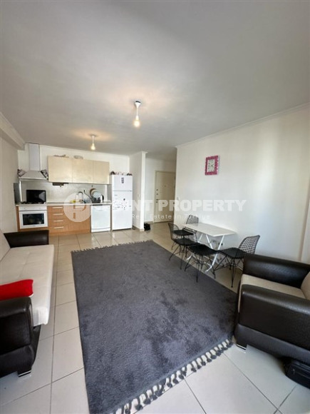 Inexpensive apartment 60 m2 with furniture and a glazed balcony in a high-rise building, Mahmutlar district-id-4474-photo-3