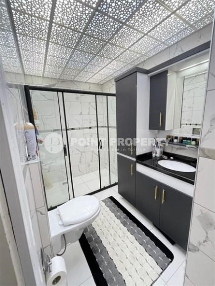 Panoramic apartment 3+1 on the 10th floor in the center of Mahmutlar.-id-4478-photo-12