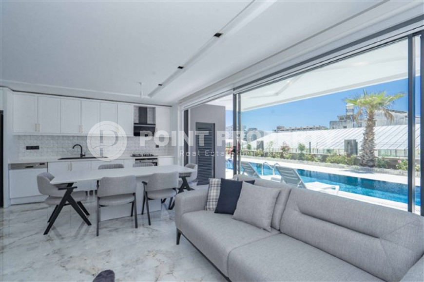 Stylish two-level apartment with access to the pool in a comfortable residential complex, commissioned in 2022.-id-4494-photo-2