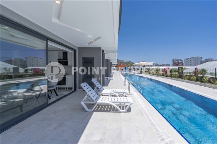 Stylish two-level apartment with access to the pool in a comfortable residential complex, commissioned in 2022.-id-4494-photo-9