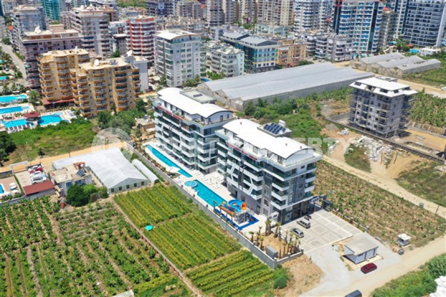 Stylish two-level apartment with access to the pool in a comfortable residential complex, commissioned in 2022.-id-4494-photo-20