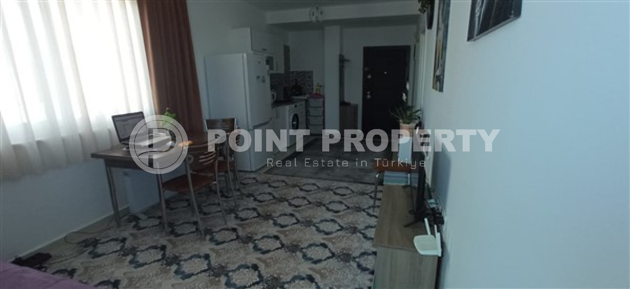 Бюджетные апартаменты 1+1 в полутора километрах от моря в перспективном районе Аланьи - Конаклы.-id-4499-фото-3