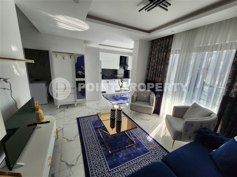 Новые двухуровневые апартаменты с дизайнерским ремонтом в центре Аланьи и в 900 метрах от моря.-id-4533-фото-2