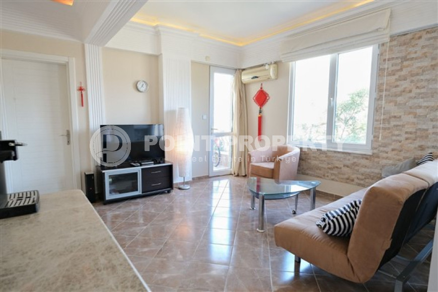 Small comfortable apartment 1+1, with a total area of 55 m2, 700 meters from the beach in the center of Alanya.-id-4537-photo-1