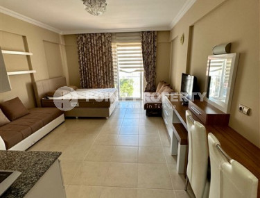 Inexpensive one-room studio 40 m2 with a balcony, Mahmutlar district-id-4609-photo-1