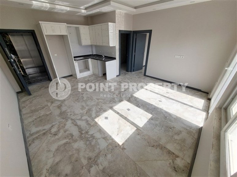 Новая квартира 1+1 с площадью 60 м2 в недавно построенной резиденции, район Авсаллар-id-4610-фото-2