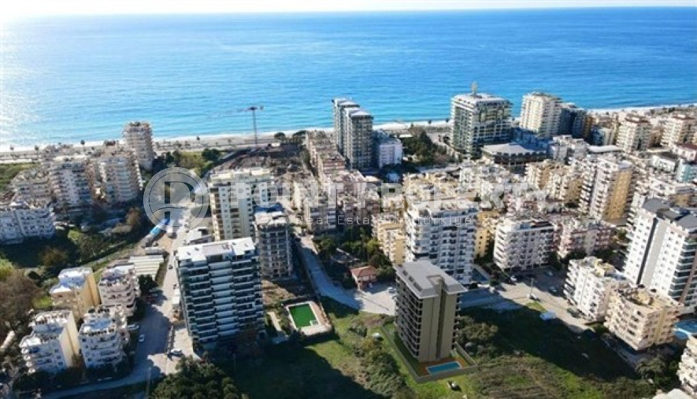 Apartment 1+1 with an area of 56 m2 in a new high-rise residence under construction, Mahmutlar-id-4635-photo-4