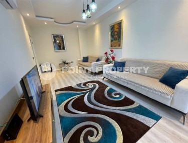 Modern apartment on the 5th floor in a residence built in 2020 in the center of Mahmutlar.-id-4640-photo-1