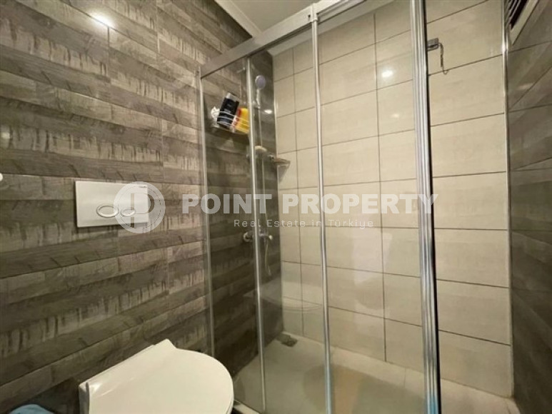 Modern apartment on the 5th floor in a residence built in 2020 in the center of Mahmutlar.-id-4640-photo-7