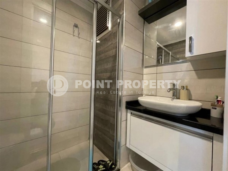 Modern apartment on the 5th floor in a residence built in 2020 in the center of Mahmutlar.-id-4640-photo-8