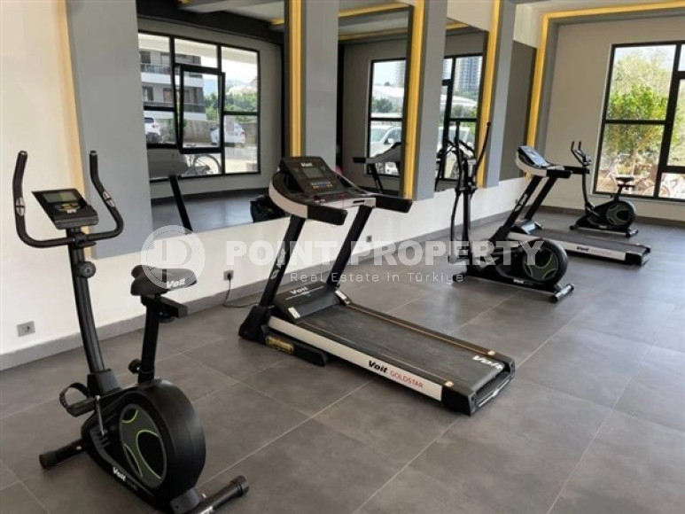 Modern apartment on the 5th floor in a residence built in 2020 in the center of Mahmutlar.-id-4640-photo-12