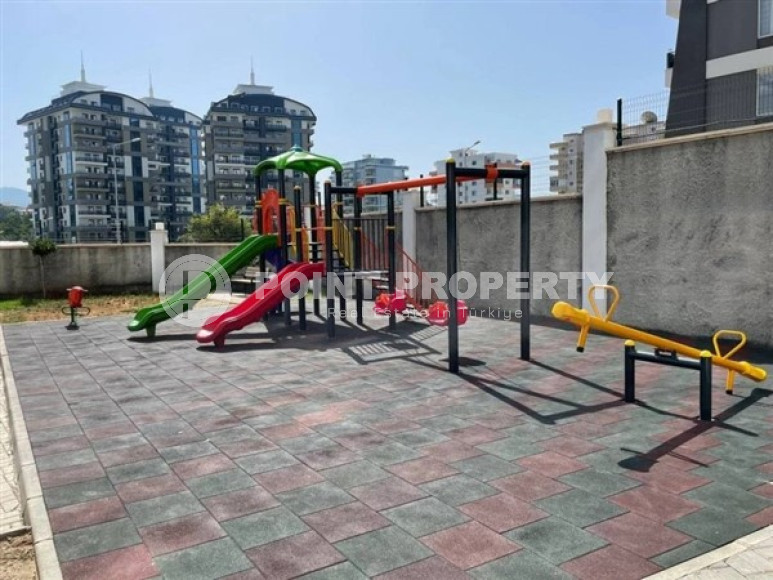 Modern apartment on the 5th floor in a residence built in 2020 in the center of Mahmutlar.-id-4640-photo-16