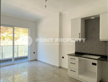 Compact 1+1 apartment on the 1st floor in a new residence, commissioned in 2023.-id-4658-photo-1
