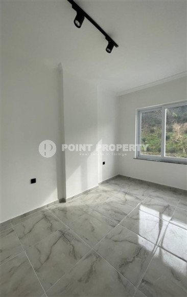 Апартаменты 1+1 с чистовой отделкой в новом жилом комплексе в районе Авсаллар.-id-4661-фото-3