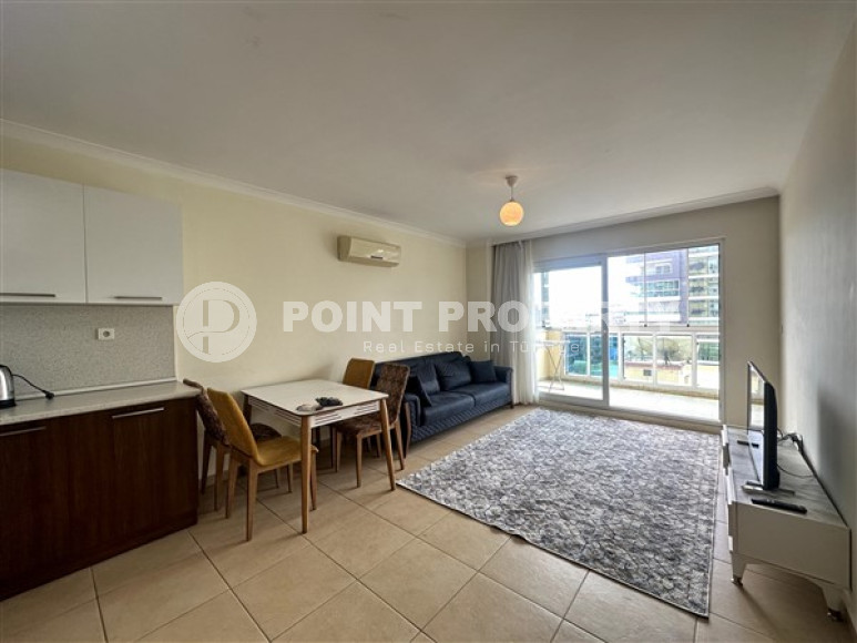 Spacious one bedroom apartment 650 meters from the beach and promenade in the center of Mahmutlar.-id-4664-photo-1