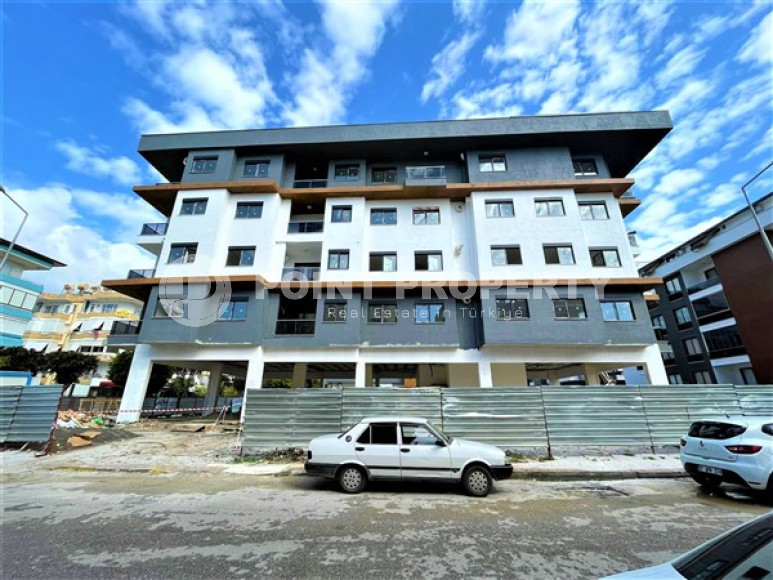 Двухуровневая квартира с тремя спальнями на этапе строительства, в центре Алании, 300м до моря-id-1695-фото-2