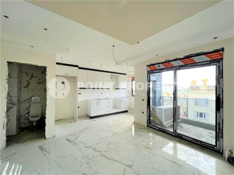 Двухуровневая квартира с тремя спальнями на этапе строительства, в центре Алании, 300м до моря-id-1695-фото-5