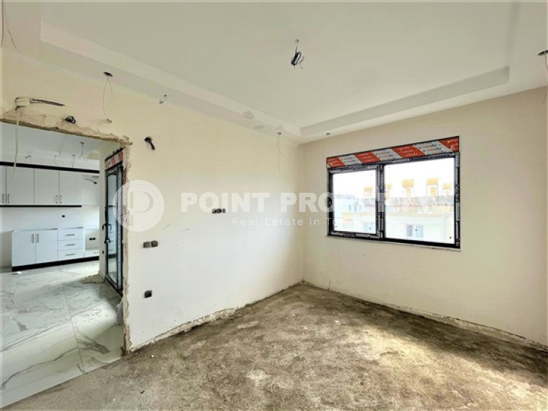 Двухуровневая квартира с тремя спальнями на этапе строительства, в центре Алании, 300м до моря-id-1695-фото-6