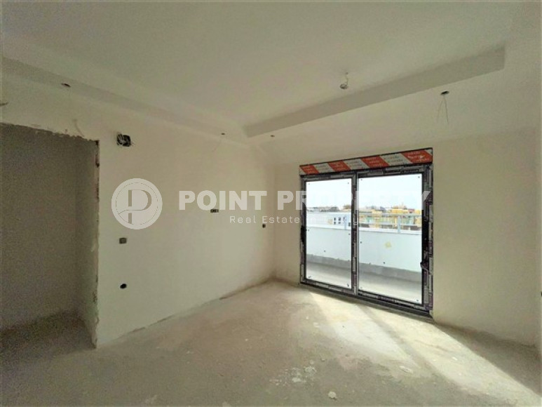 Двухуровневая квартира с тремя спальнями на этапе строительства, в центре Алании, 300м до моря-id-1695-фото-7