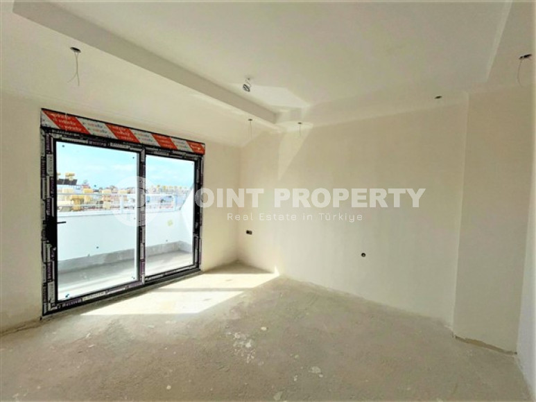 Двухуровневая квартира с тремя спальнями на этапе строительства, в центре Алании, 300м до моря-id-1695-фото-8