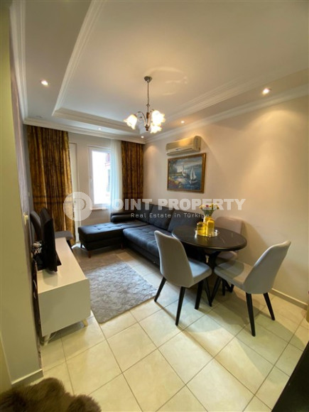 Compact furnished 1+1 apartment within walking distance from Cleopatra Beach in the center of Alanya.-id-4695-photo-1