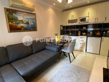 Компактная меблированная квартира 1+1 в нескольких минутах ходьбы от пляжа Клеопатры в центре Аланьи.-id-4695-фото-2