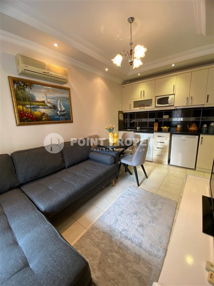 Компактная меблированная квартира 1+1 в нескольких минутах ходьбы от пляжа Клеопатры в центре Аланьи.-id-4695-фото-2