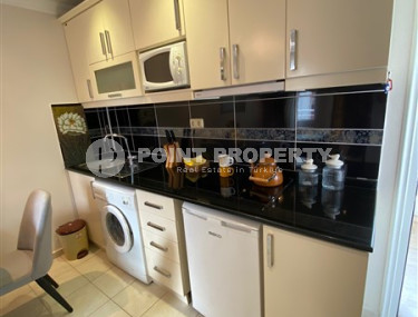 Компактная меблированная квартира 1+1 в нескольких минутах ходьбы от пляжа Клеопатры в центре Аланьи.-id-4695-фото-3