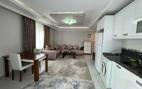 Comfortable furnished 1+1 apartment 500 meters from the sea in the center of Mahmutlar.-id-4698-photo-1