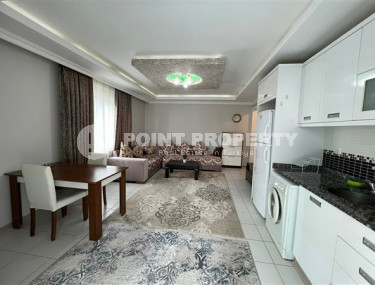 Comfortable furnished 1+1 apartment 500 meters from the sea in the center of Mahmutlar.-id-4698-photo-1