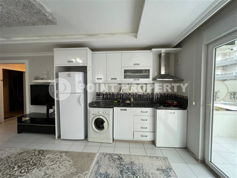 Comfortable furnished 1+1 apartment 500 meters from the sea in the center of Mahmutlar.-id-4698-photo-5