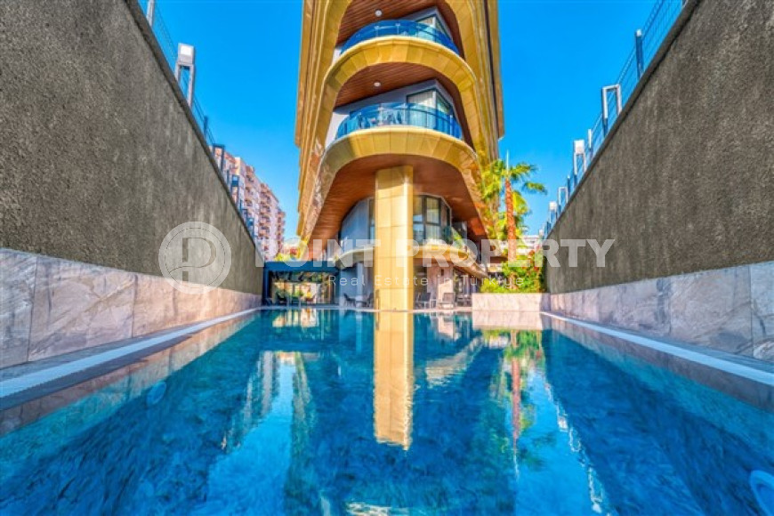 Новая квартира 1+1 в комфортабельной резиденции в центре Аланьи и в 450 метрах от  знаменитого пляжа Клеопатры.-id-4702-фото-16