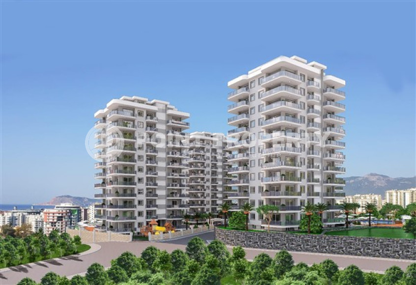 Three apartments with a 2+1 layout in a complex under construction, Mahmutlar district. The completion date of the work is August 2023.-id-4706-photo-1