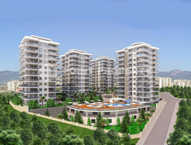 Three apartments with a 2+1 layout in a complex under construction, Mahmutlar district. The completion date of the work is August 2023.-id-4706-photo-2