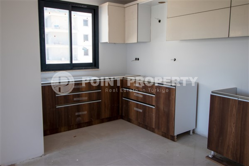 Three apartments with a 2+1 layout in a complex under construction, Mahmutlar district. The completion date of the work is August 2023.-id-4706-photo-3