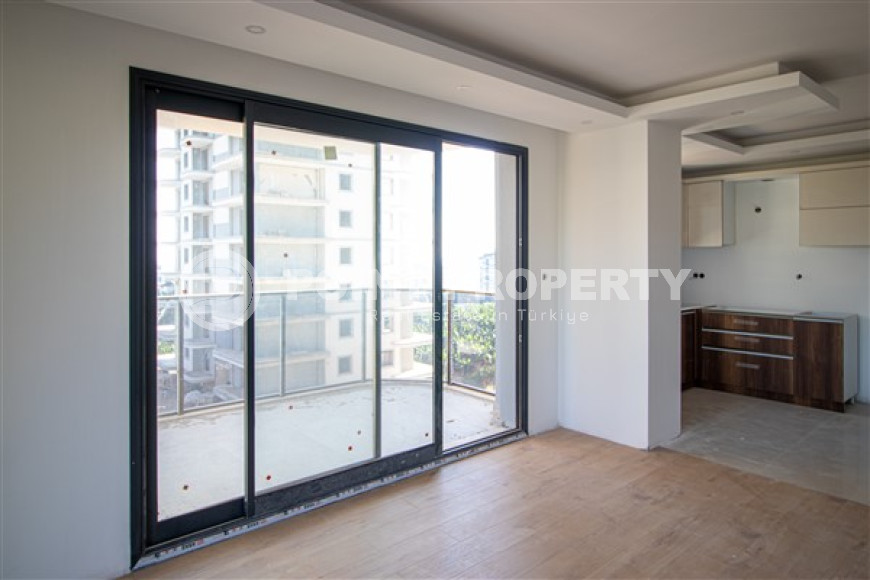 Three apartments with a 2+1 layout in a complex under construction, Mahmutlar district. The completion date of the work is August 2023.-id-4706-photo-5