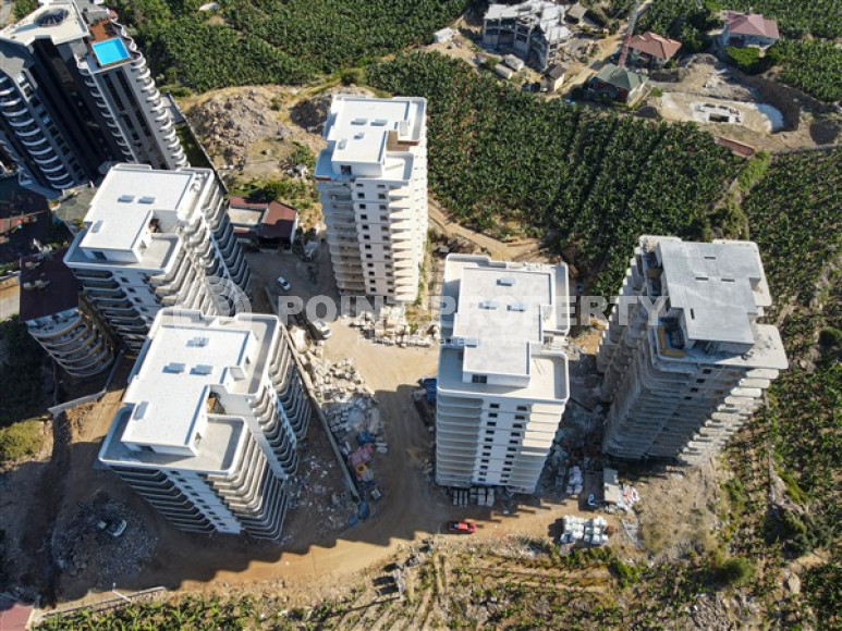 Three apartments with a 2+1 layout in a complex under construction, Mahmutlar district. The completion date of the work is August 2023.-id-4706-photo-9